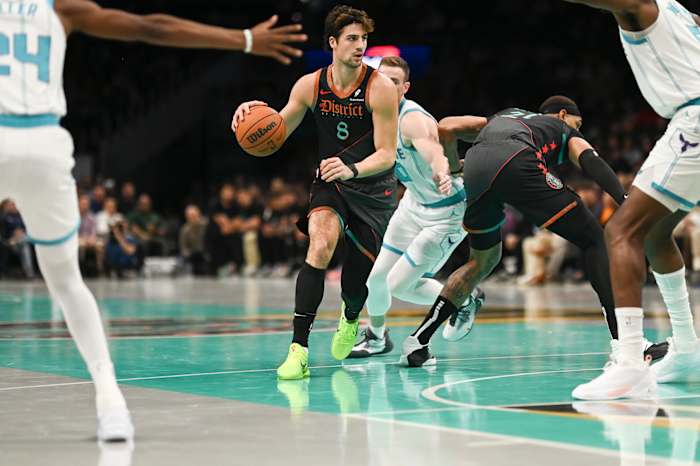 Washington Wizards forward Deni Avdija (8) looks to pass during the artist half against the Charlotte Hornets at Capital One Arena.